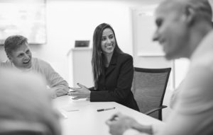 Woman conducting SCRUM meeting